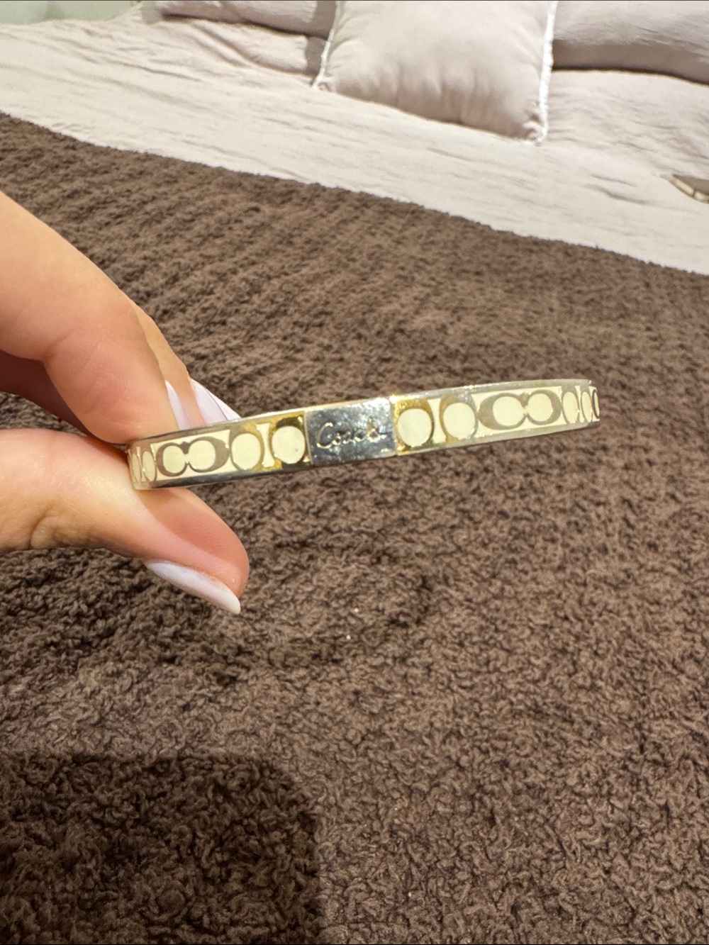 Vintage Coach worn gold plated stainless steel cream patterned bangle bracelet